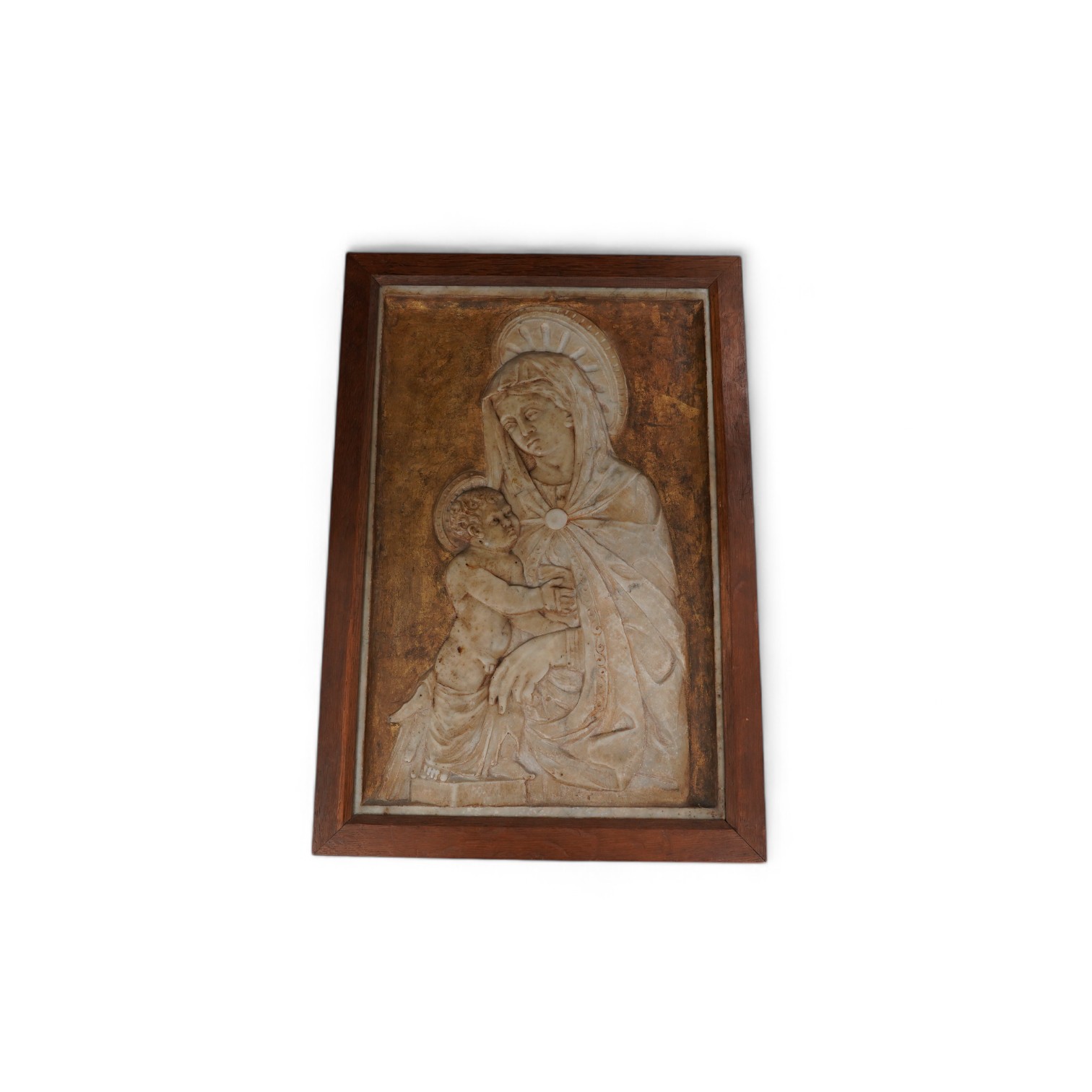 A late 19th century carved alabaster relief of Madonna and child, in an oak frame, frame 50.5cm x 34.5cm. Condition - fair to good